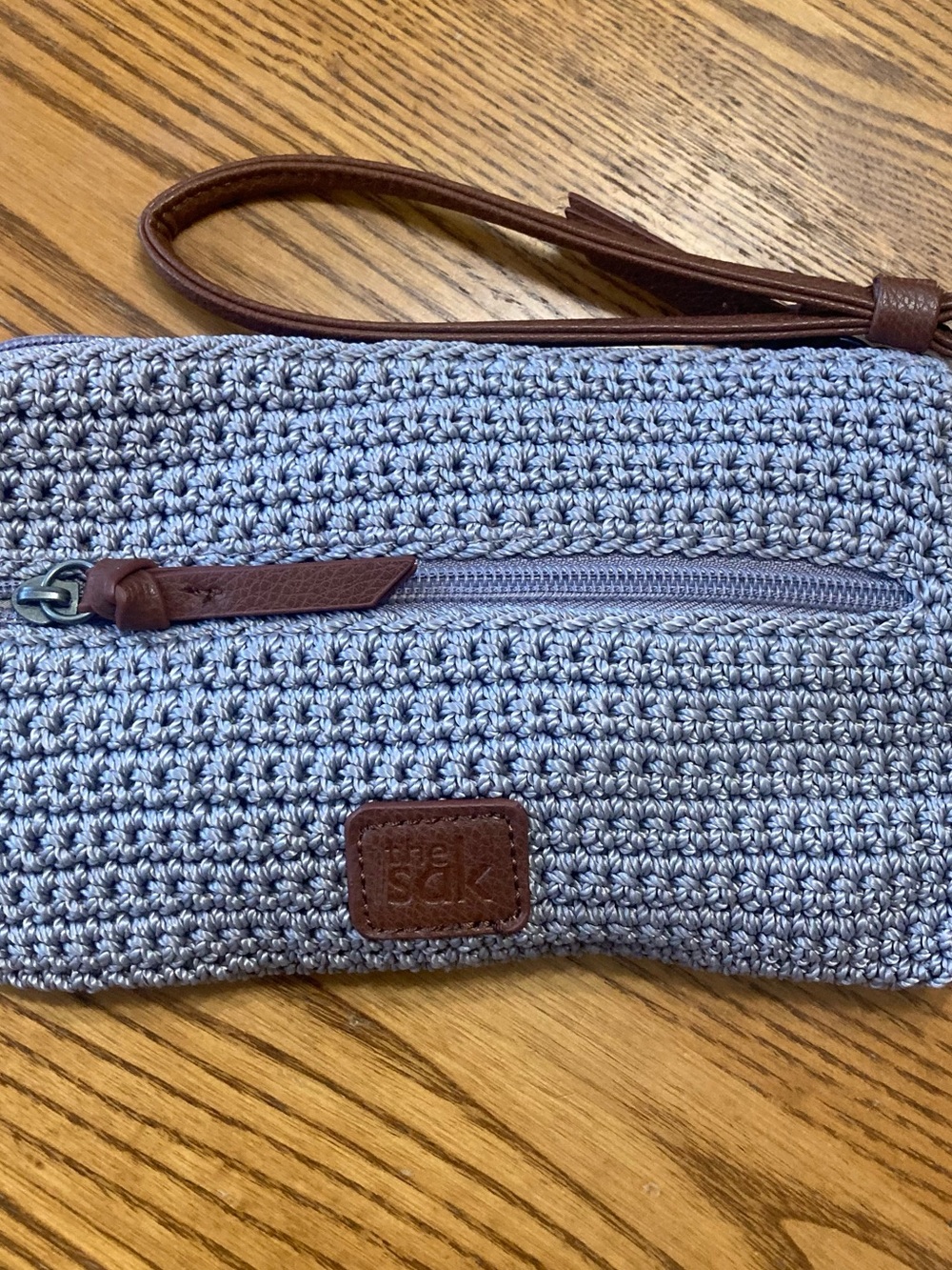 The Sak Light Blue Woven Wristlet with Brown Trim